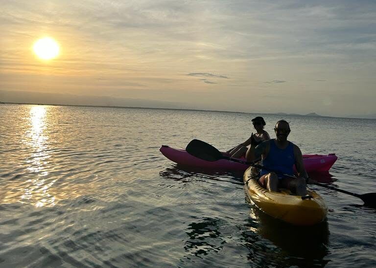Couple kayaking at sunset — Ilha do Mel belonging in its simplest form
